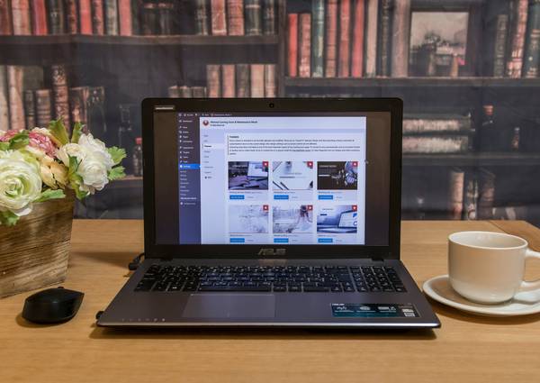 A modern workspace showing a user managing account settings on a laptop for online privacy