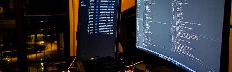 Modern workspace with a laptop running code and network cables, representing advanced proxy scripting and chaining