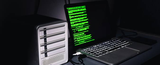 A modern stock photo showing the concept of DNS privacy, with a computer and server racks or a network diagram