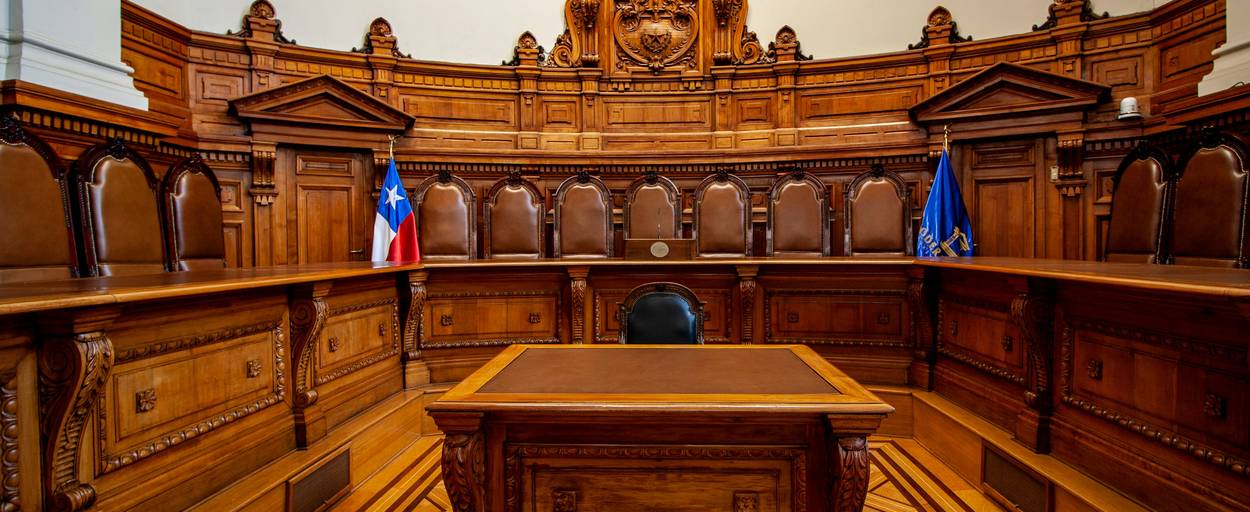 A photo of a judge's gavel and scales of justice on a desk, symbolizing legal considerations for proxy and VPN use worldwide