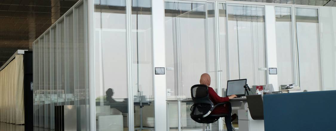 Wide stock photo of a modern server room or person using technology, representing proxy servers and online privacy