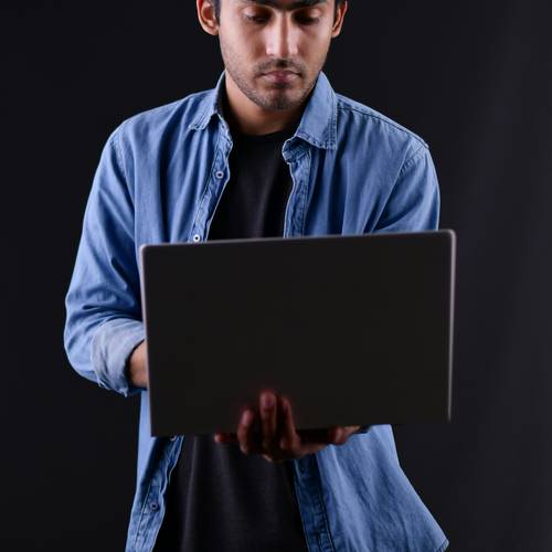 Stock photo showing a person at a laptop with digital security overlay, symbolizing proxy privacy