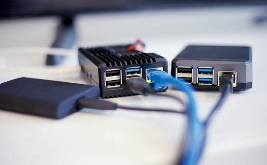 Stock photo showing the concept of internet privacy, split between VPN and Proxy, with network cables and laptops